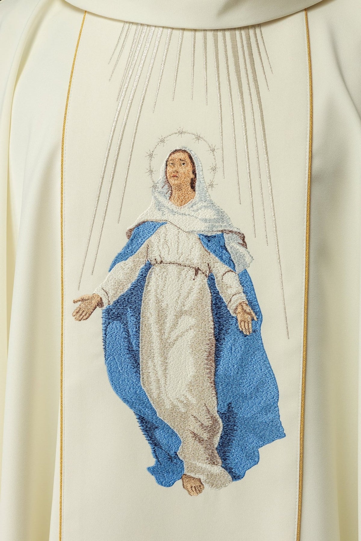 Chasuble close-up showing embroidered Our Lady in blue and ivory