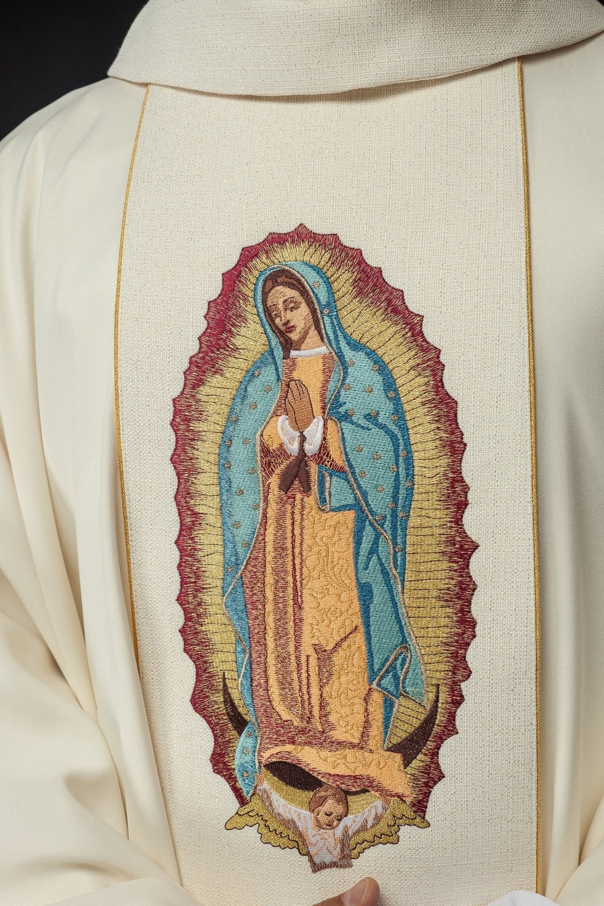 Gold chasuble close-up of Our Lady of Guadalupe embroidered on the orphrey