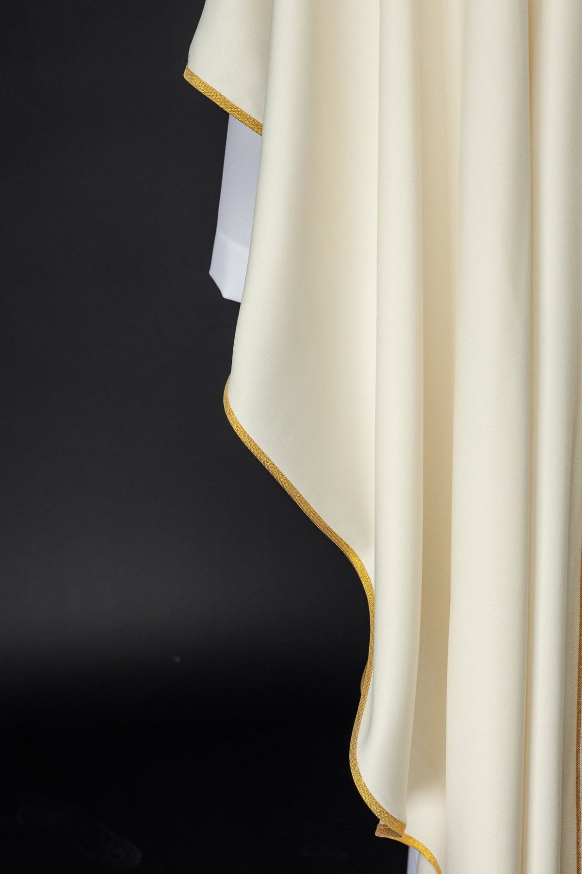Gold chasuble side view with flowing satin trim