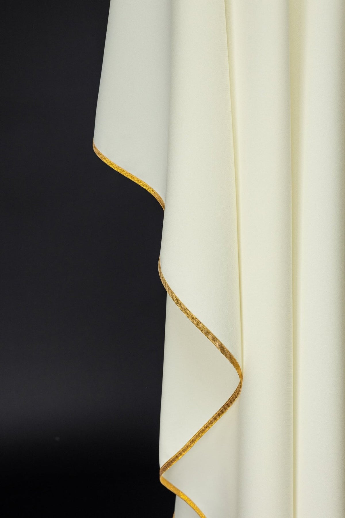 Ivory chasuble, close-up of gold trim along the sleeve edge