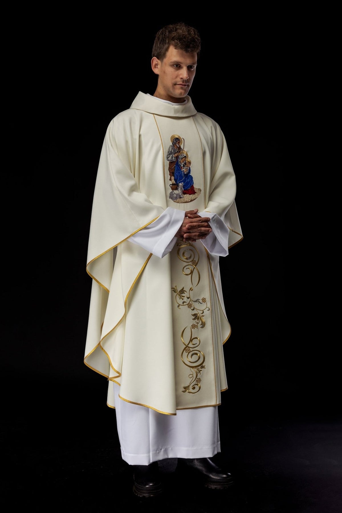 Holy Family chasuble, angled front view with embroidered image and gold orphrey