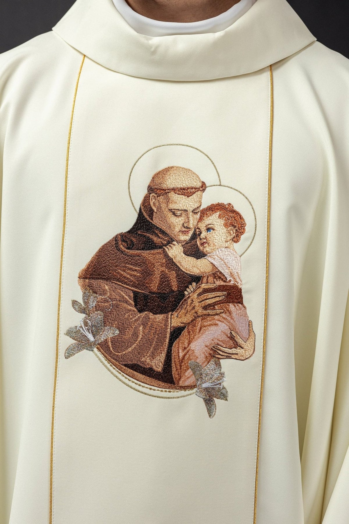 Ecru Saint Anthony chasuble close-up with embroidered Saint Anthony and Child Jesus
