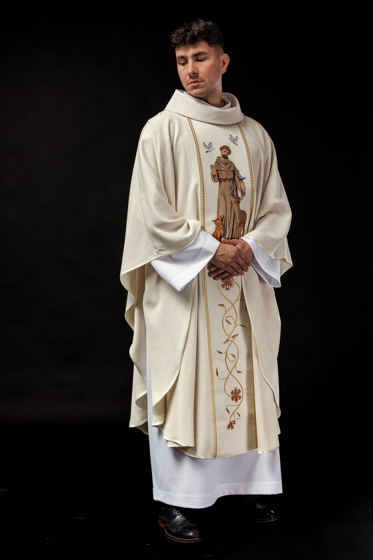 Chasuble front view showing Saint Francis embroidery, gold trim and floral orphrey