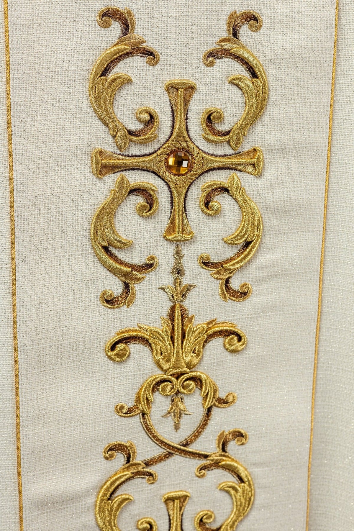 Saint Anthony chasuble close-up of gold embroidered cross with a central jewel