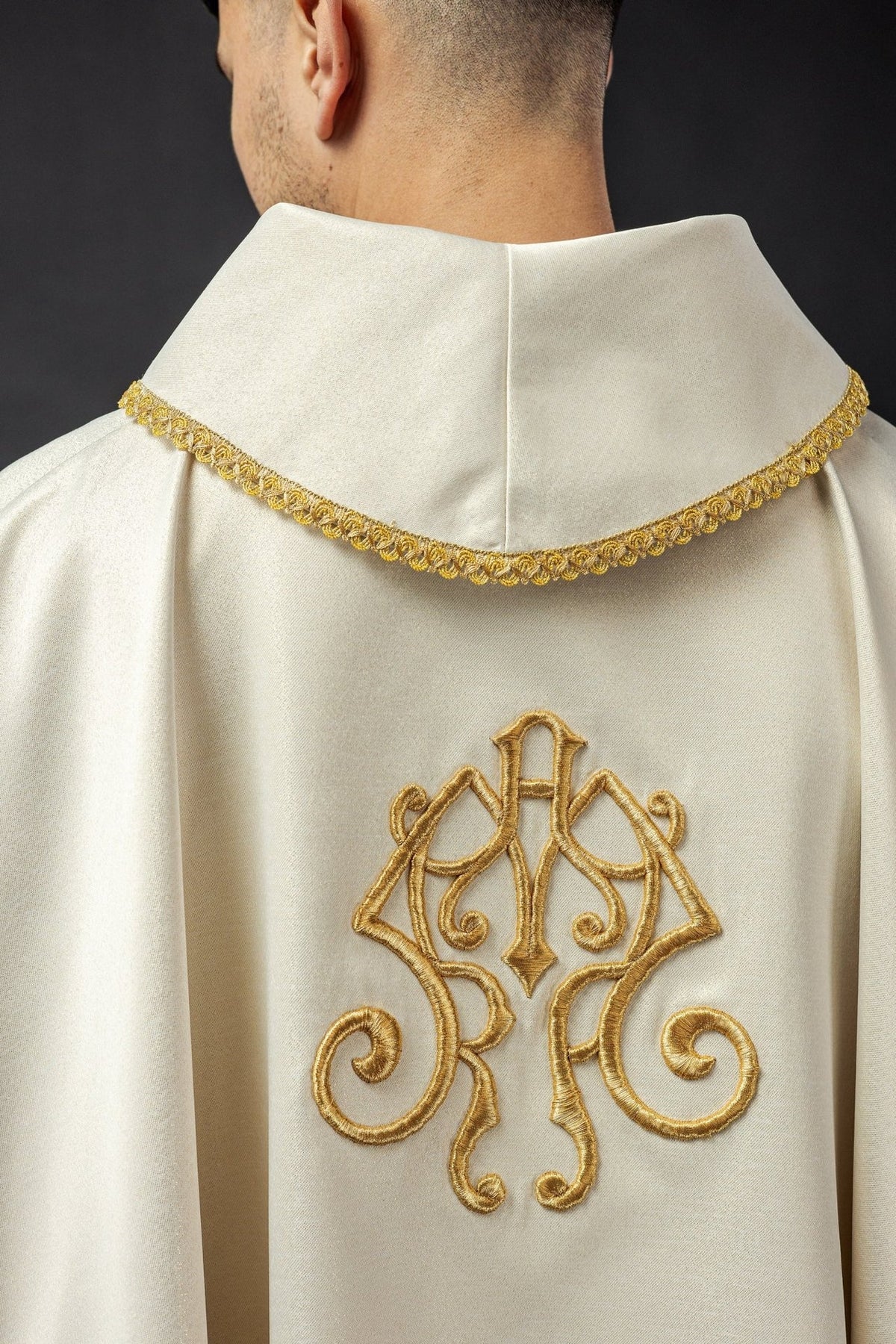 Candlemas chasuble back close-up with gold embroidered Marian monogram