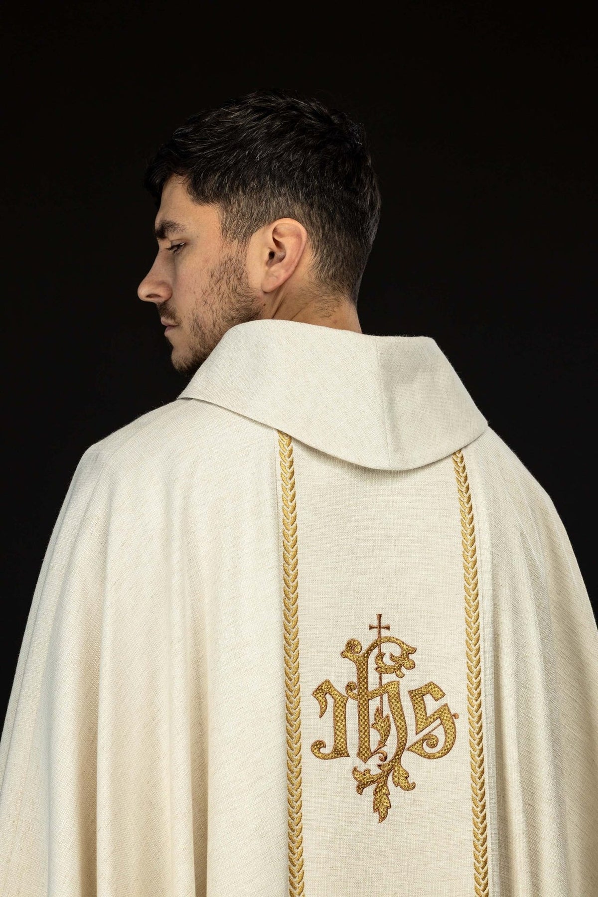 Ecru chasuble detail showing gold trim on sleeve edge