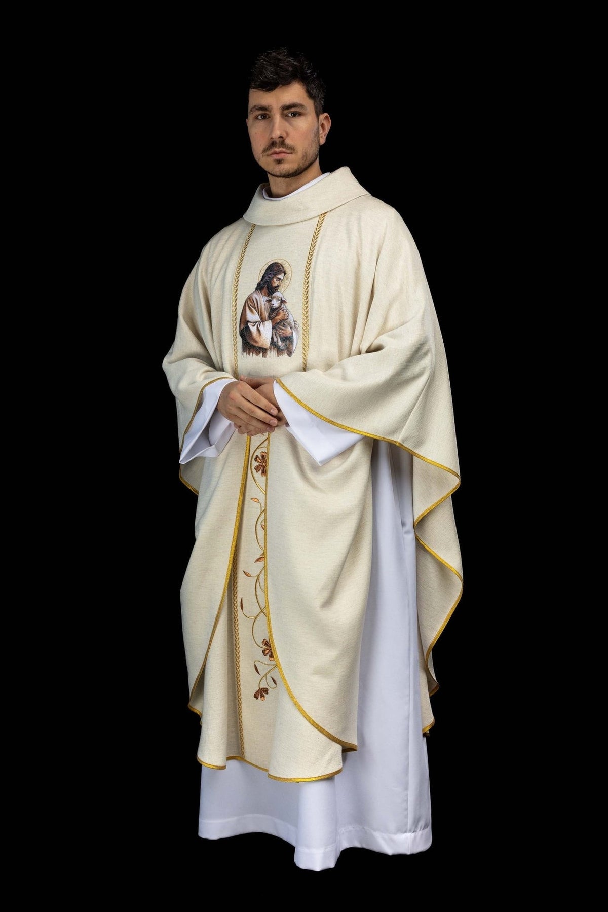 Ecru chasuble angled front view with Good Shepherd image and gold-trimmed sleeves