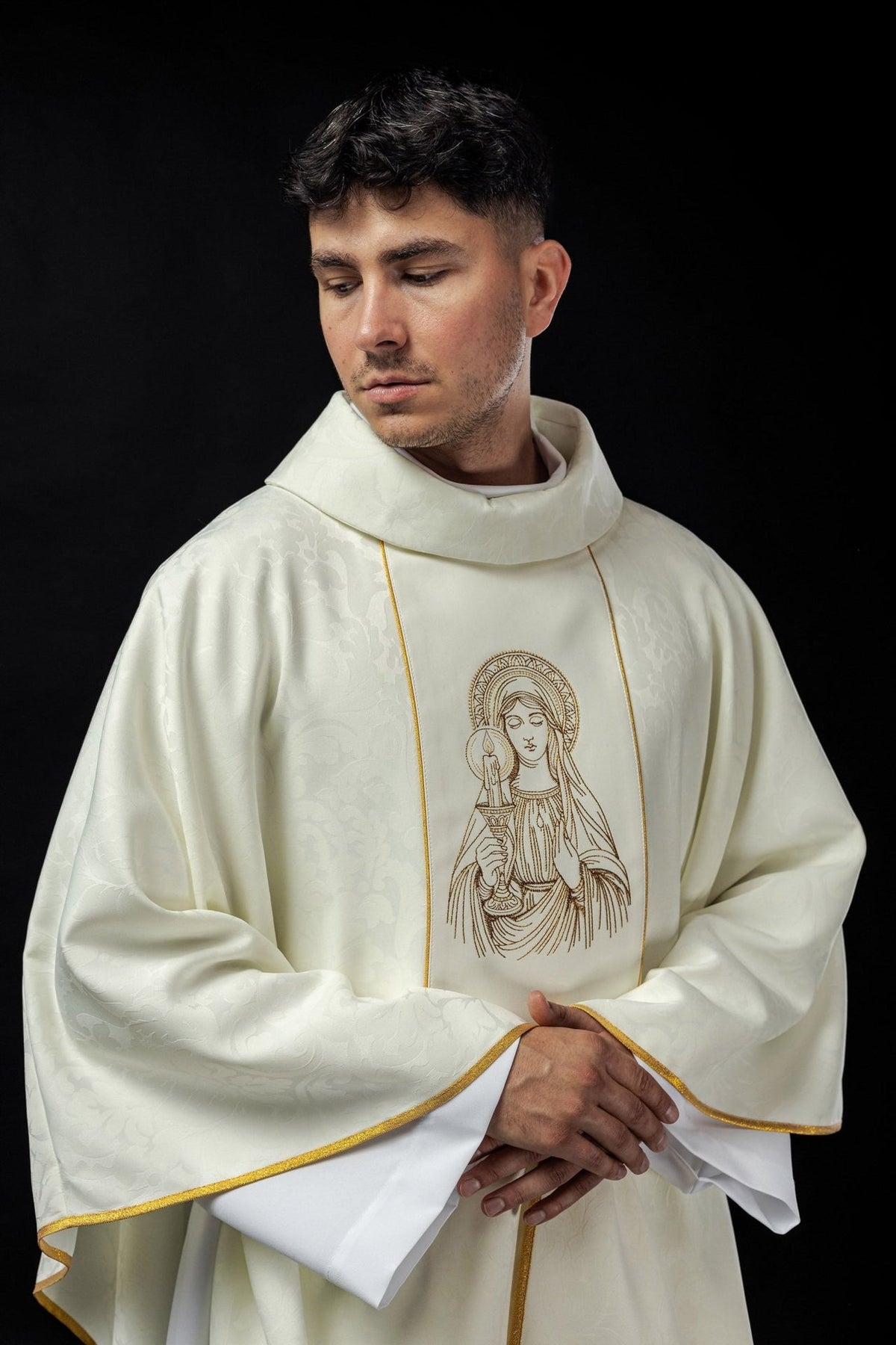 Our Lady chasuble, front view showing ivory fabric, gold trim and wide sleeves