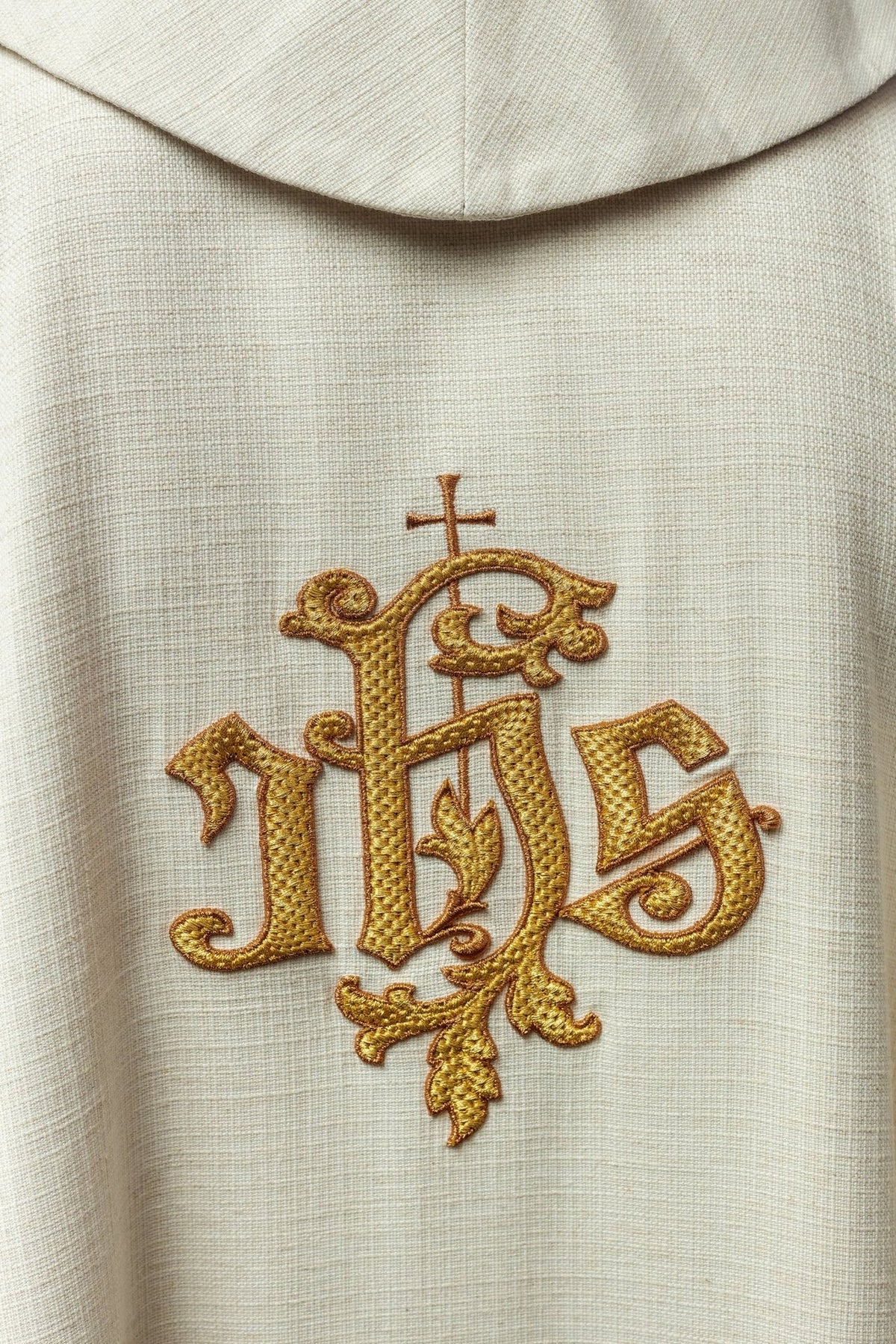 Ecru chasuble close-up of stand-up collar and woven fabric