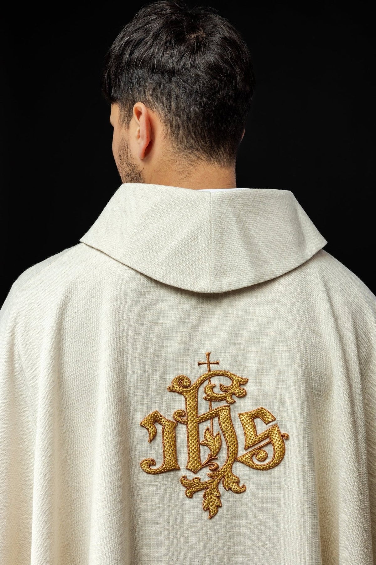 Ecru chasuble back close-up with gold IHS embroidery