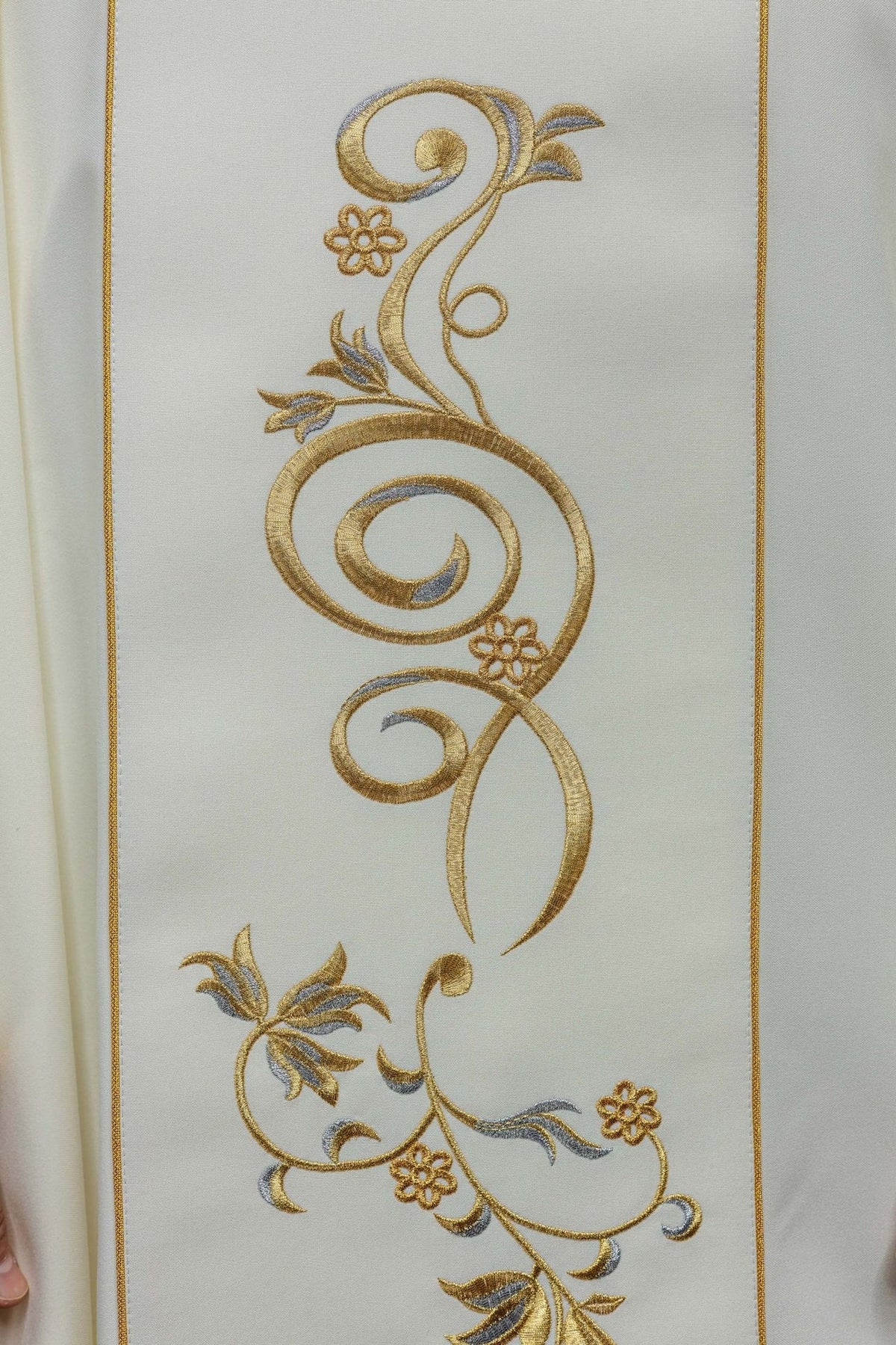 Holy Trinity chasuble close-up of gold embroidered floral scrollwork on the orphrey