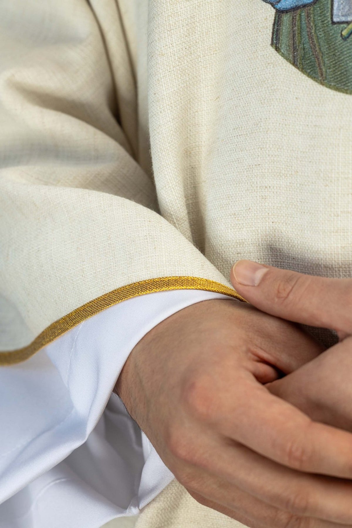 Saint Joseph the Worker chasuble, close-up of ecru fabric and gold trim