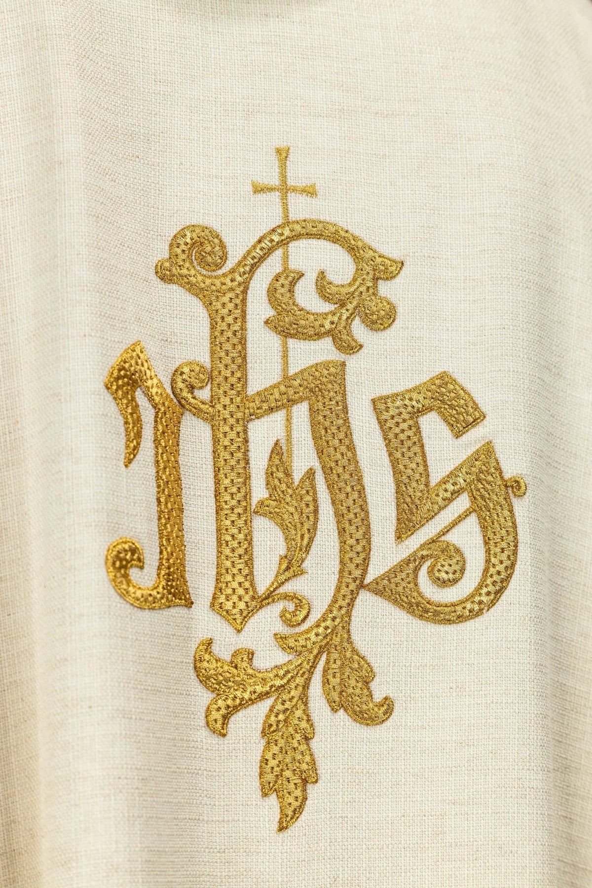 Saint Joseph the Worker chasuble, close-up of embroidered gold IHS monogram