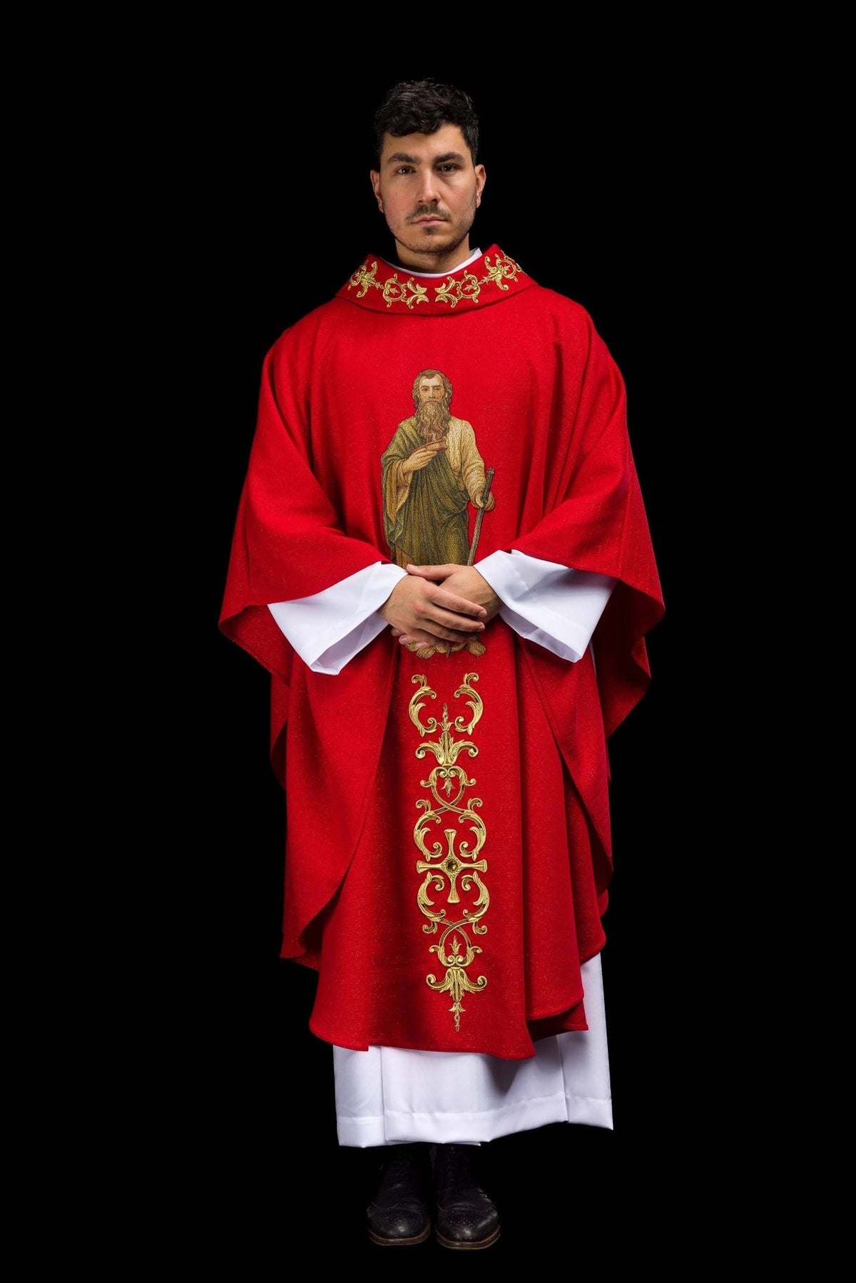 Red chasuble worn front view with Saint Paul image and gold embroidery