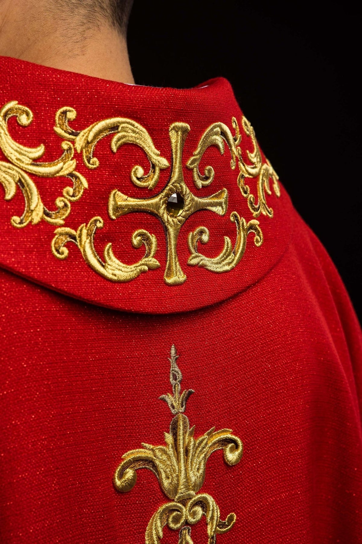 Red chasuble close-up of embroidered gold trim around the collar