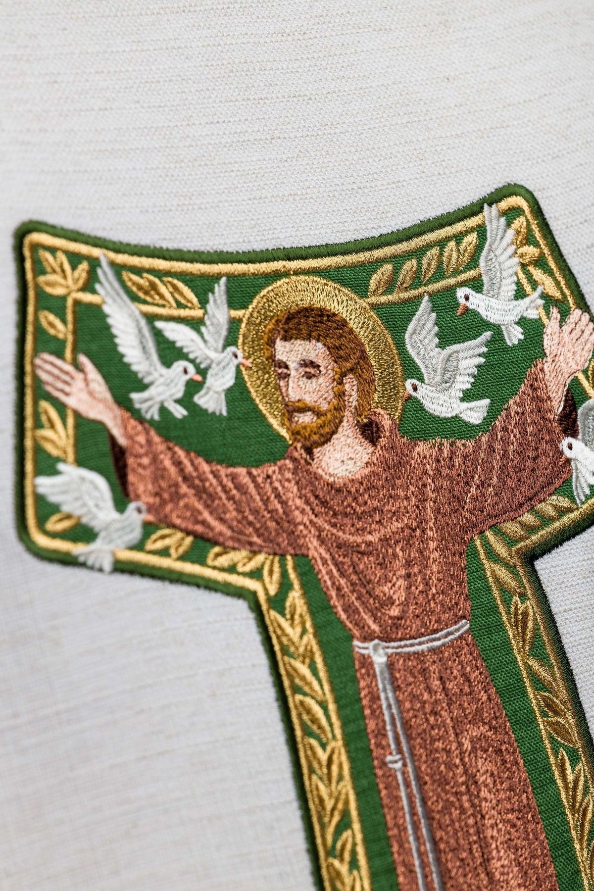 Saint Francis chasuble, close-up of embroidered image with green and gold trim