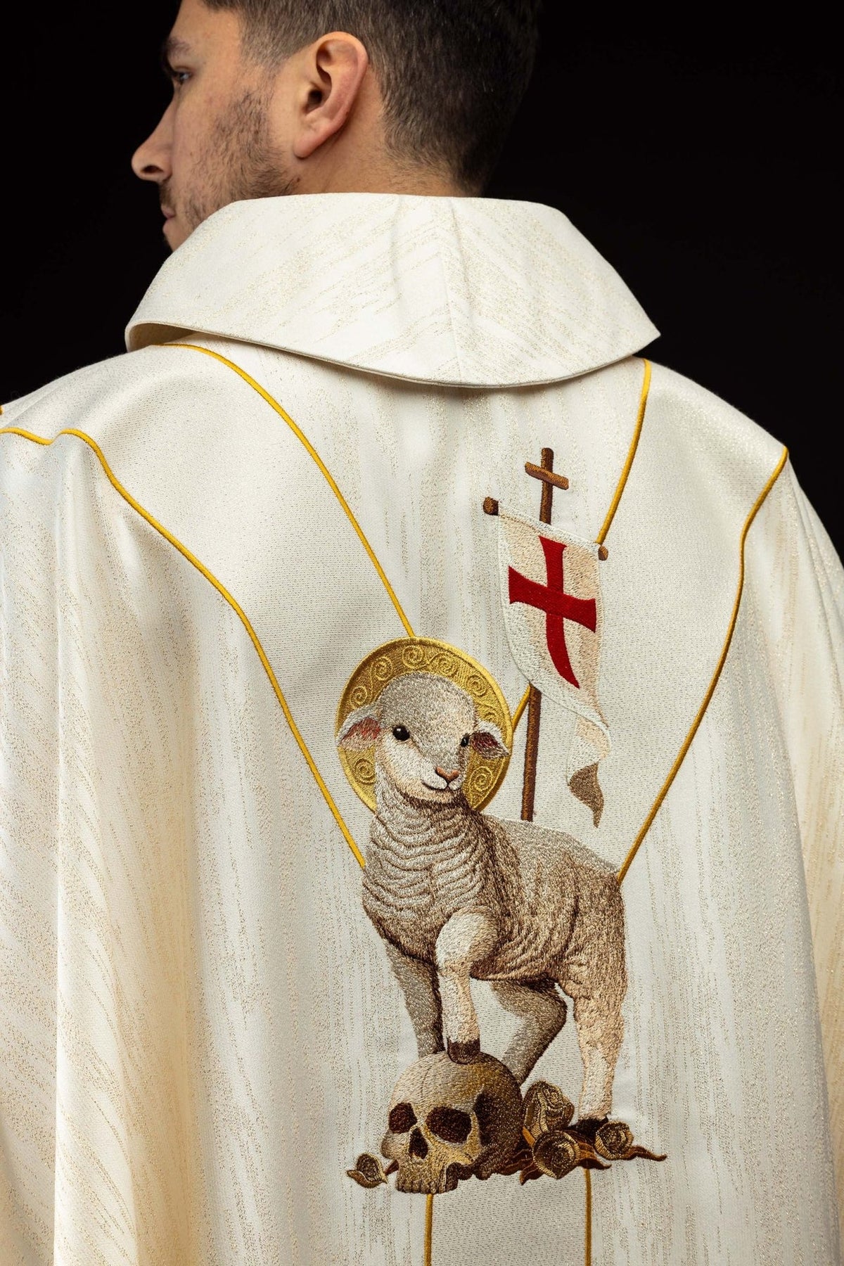 Chasuble back view with embroidered Paschal Lamb, skull, roses and red cross banner