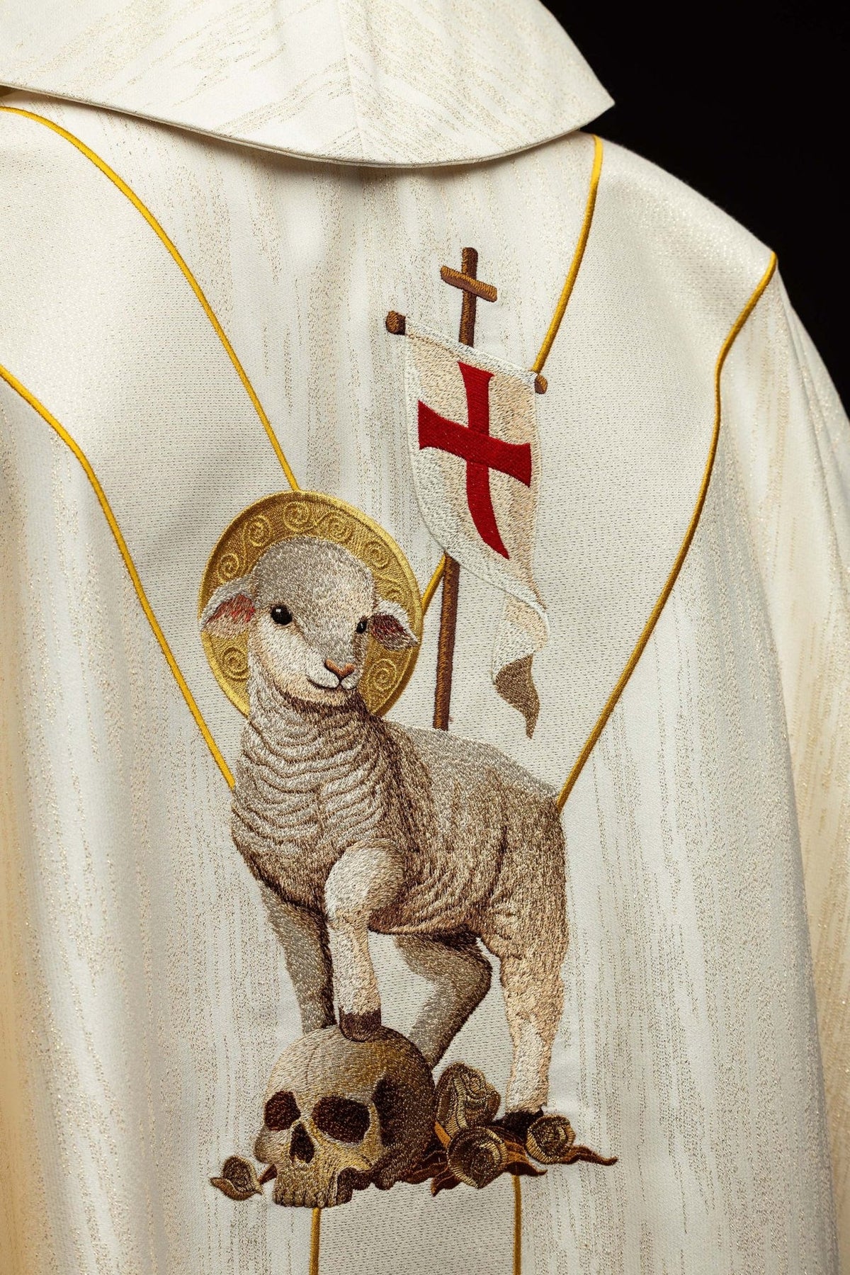Chasuble close-up showing the Risen Christ embroidery and gold trim