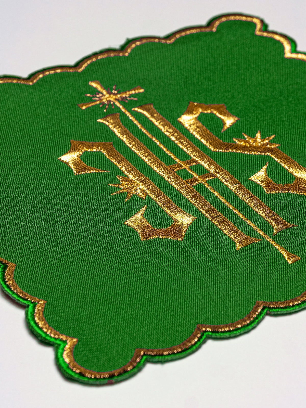 Green chalice pall with gold embroidered IHS symbol and scalloped gold edging