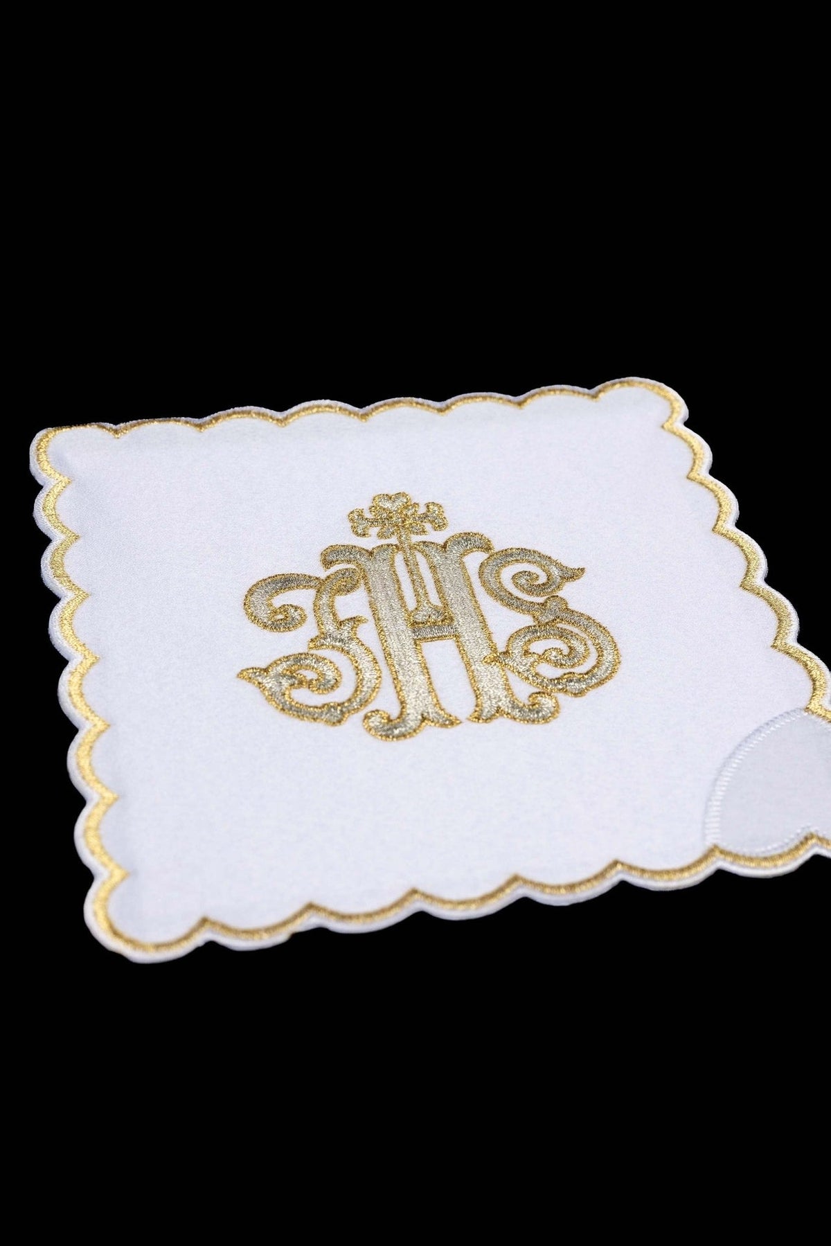 White chalice pall with embroidered IHS monogram and gold scalloped border