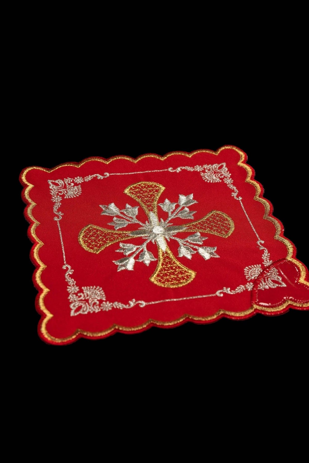 Red chalice pall close-up with gold and silver cross embroidery