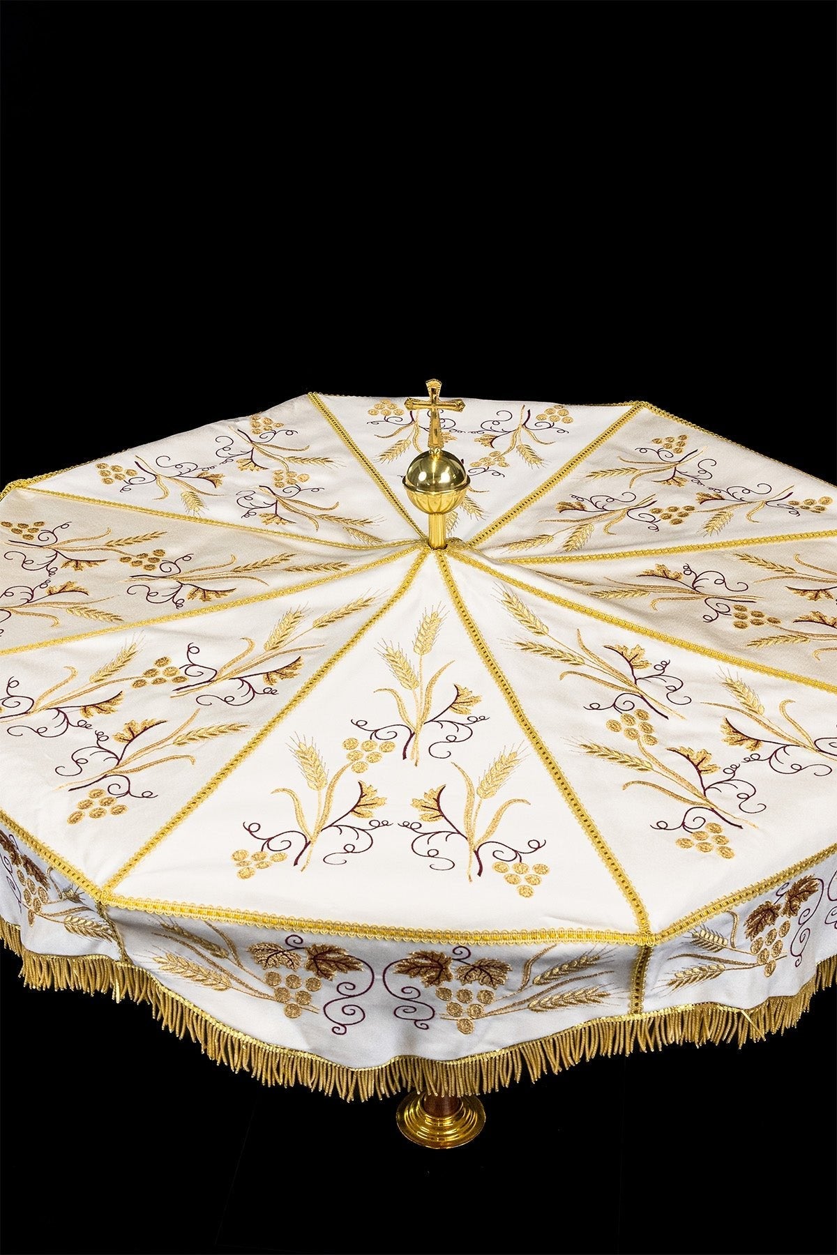 Ecru processional umbrella, wide view showing gold embroidered panels and fringe
