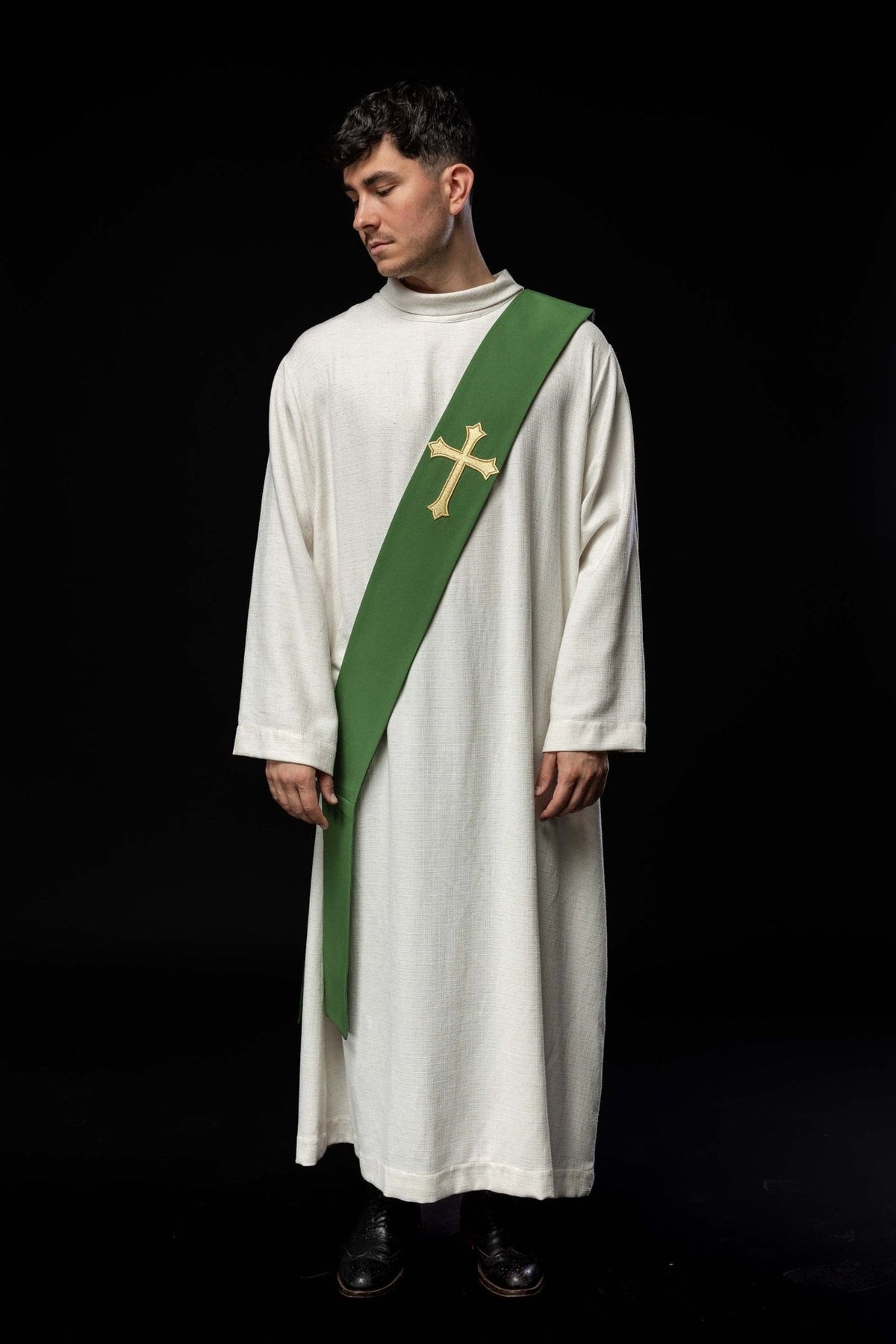 Green deacon stole worn in a full front view with a gold embroidered cross