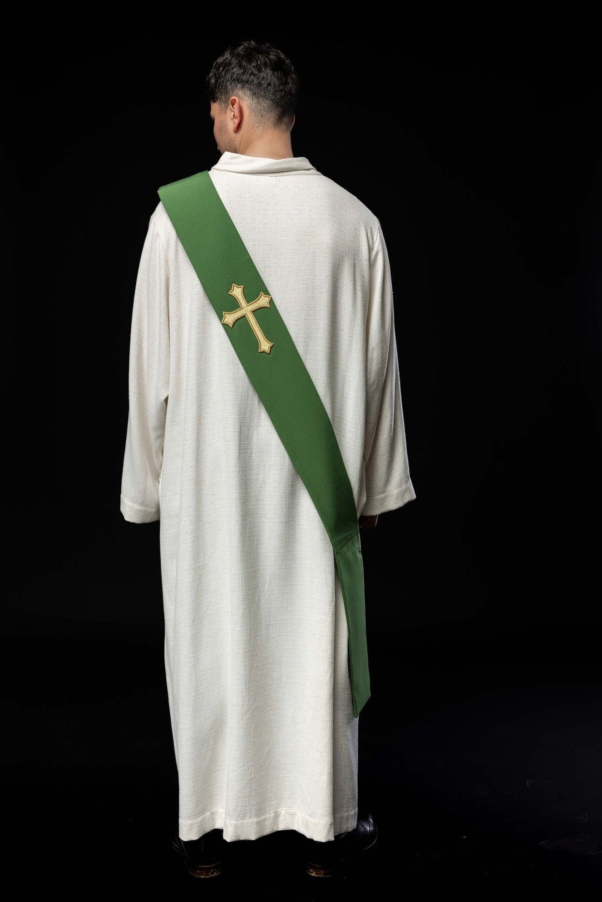 Green deacon stole worn from the back with its cross and pointed end