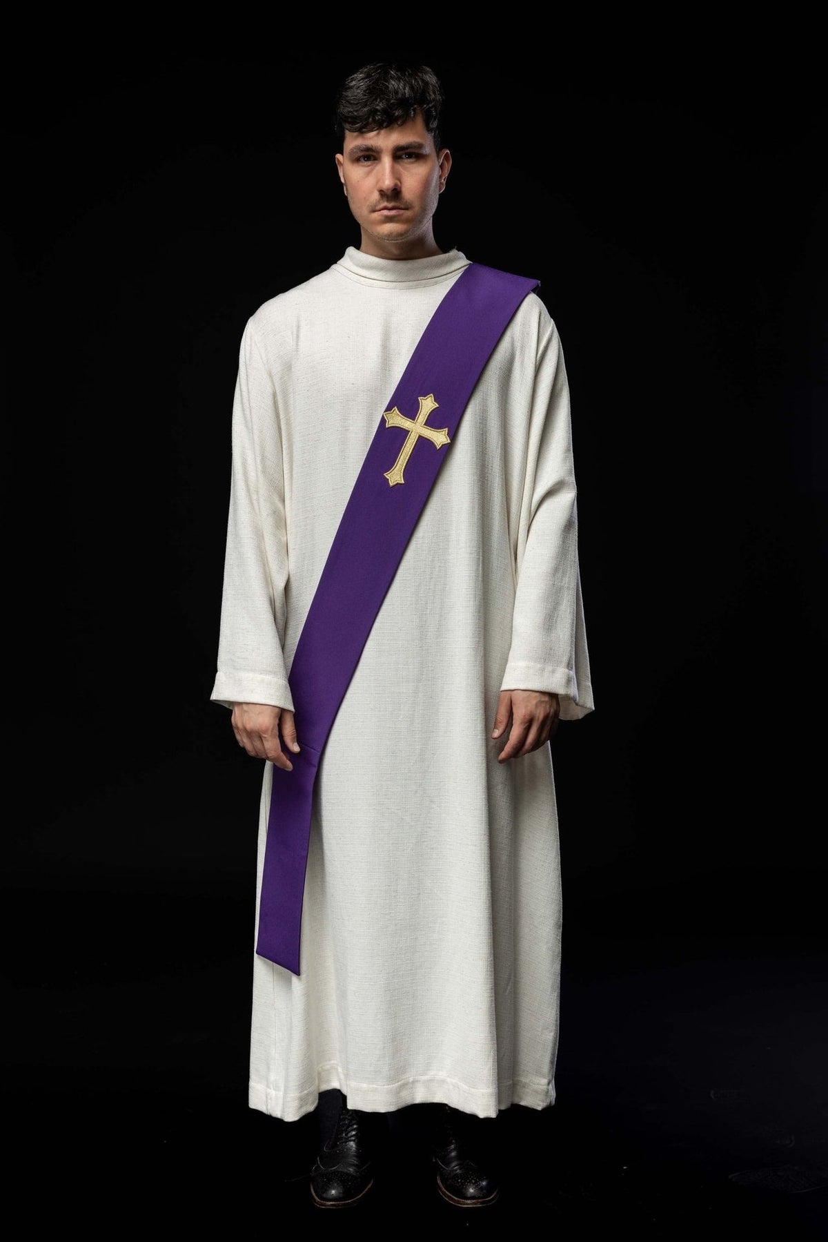 Purple deacon stole worn in full front view with a gold embroidered cross