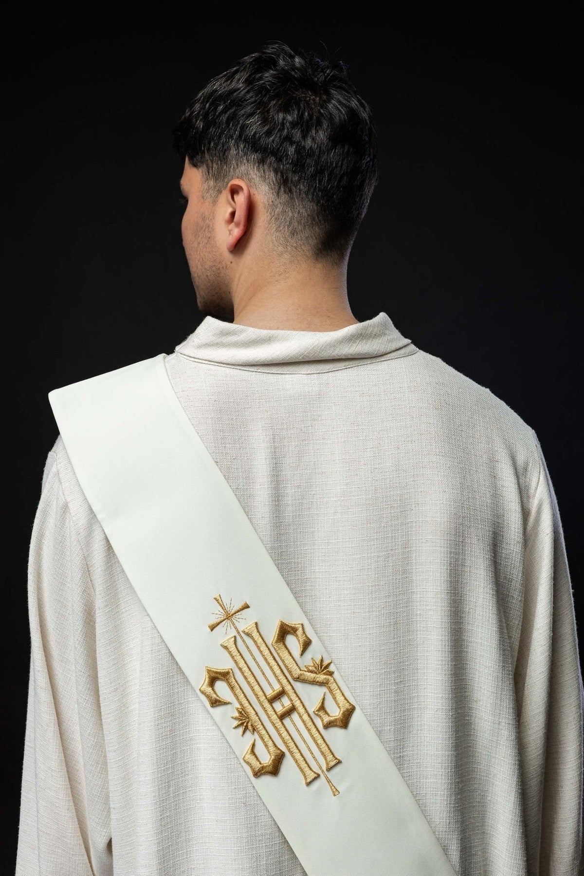 Back detail of white stole with plain fabric and lower seam