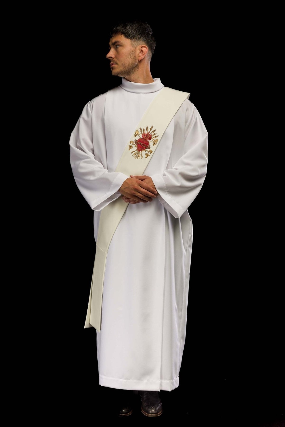 Embroidered deacon stole worn from the front, showing the ivory stole and Sacred Heart of Jesus