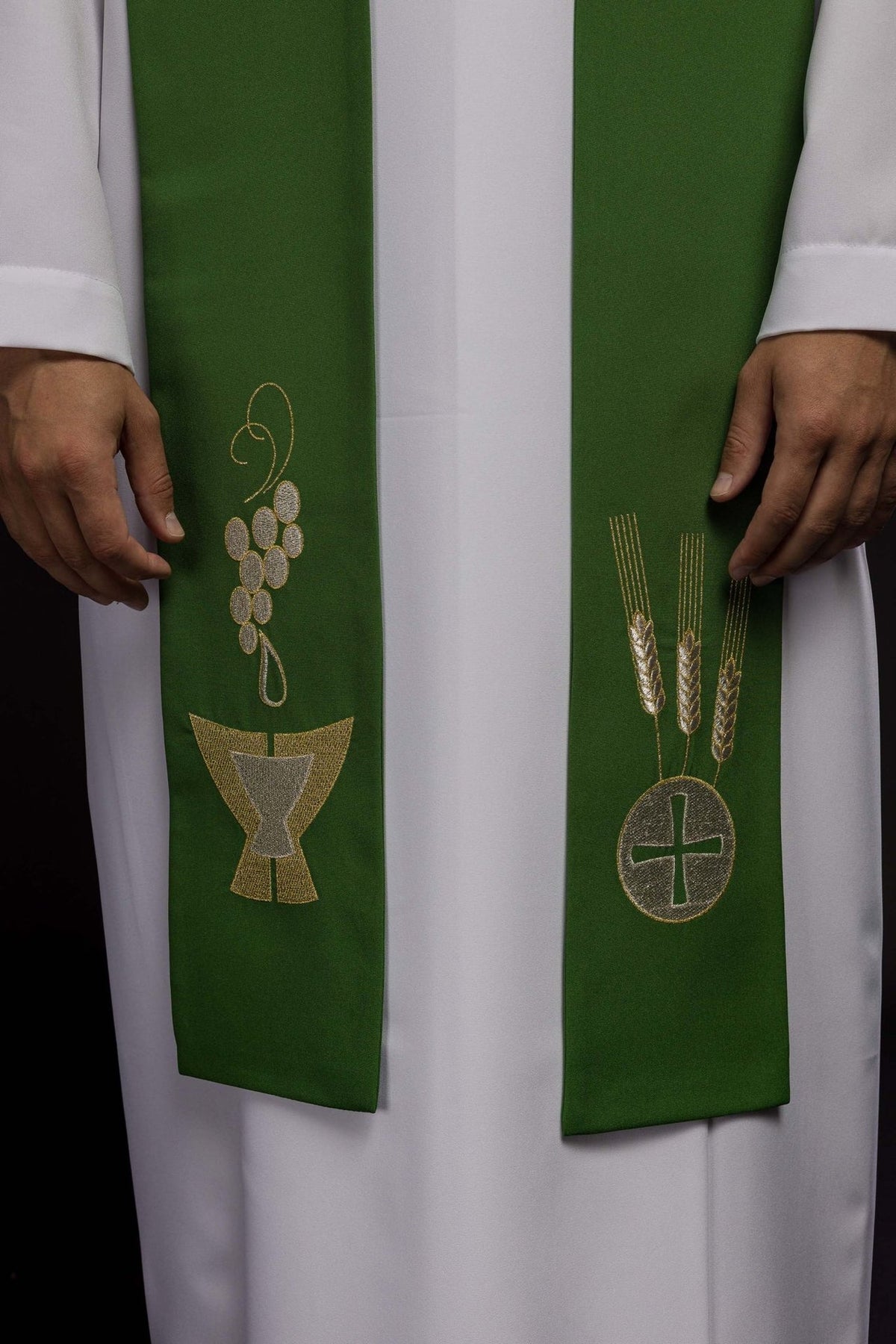 Green priest stole close-up with embroidered chalice, wheat and grapes