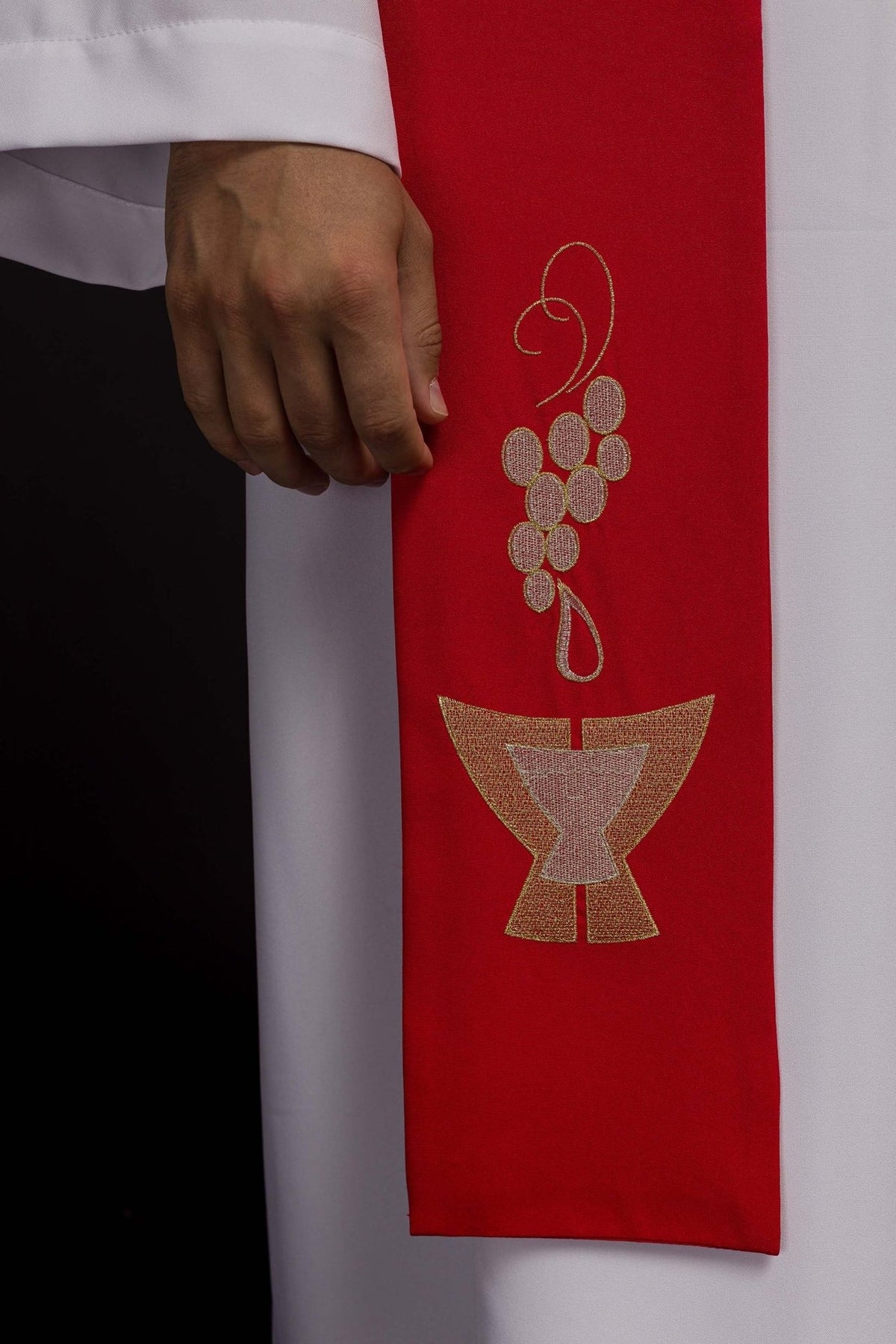 Red stole close-up showing embroidered grapes and chalice