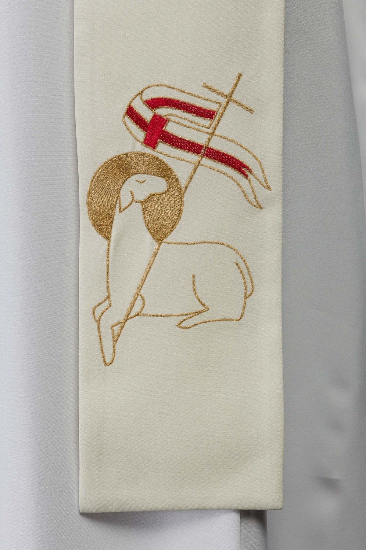 Priest stole close-up showing gold lamb and red cross embroidery