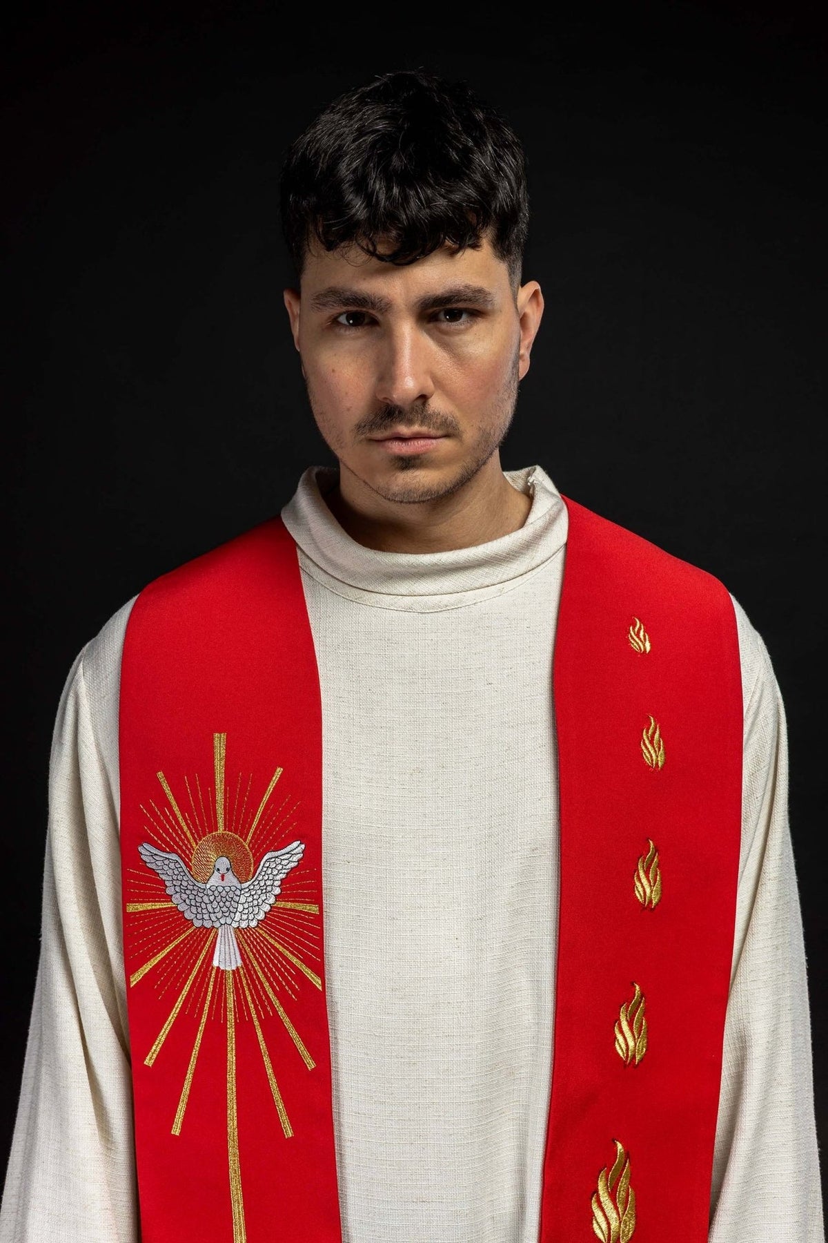 Red stole close-up showing the Holy Spirit and fiery tongues embroidery