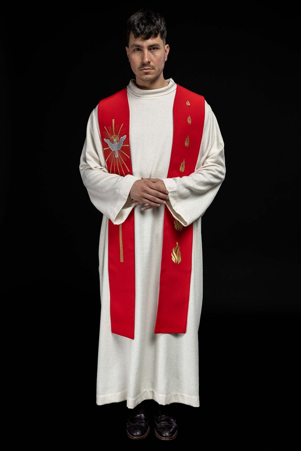 Red stole full front view worn with Holy Spirit and fiery tongues