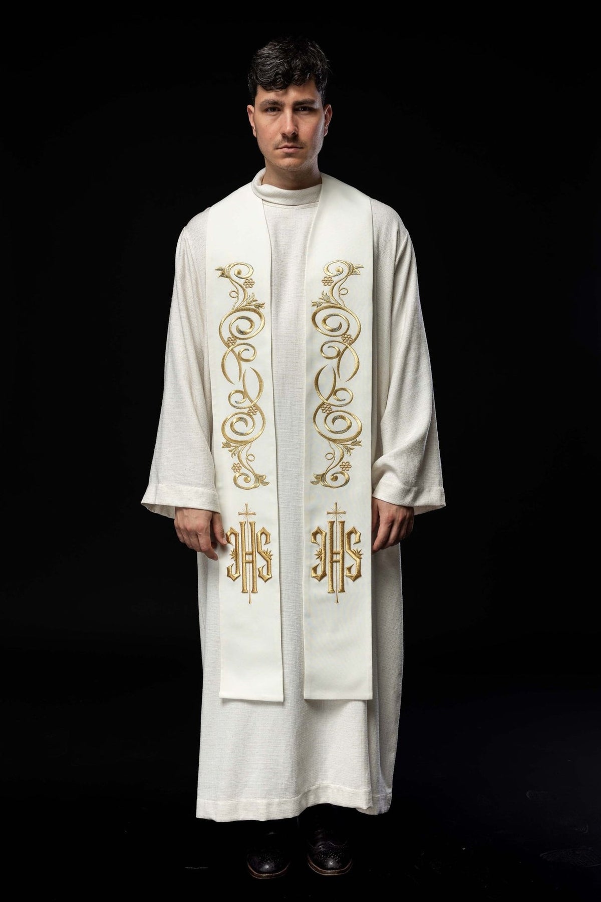 Embroidered ecru stole worn from the front with gold scroll embroidery and IHS motifs