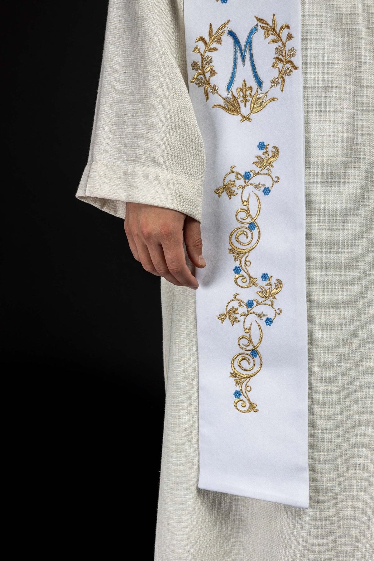 White priest stole side detail with gold and blue embroidered scrollwork