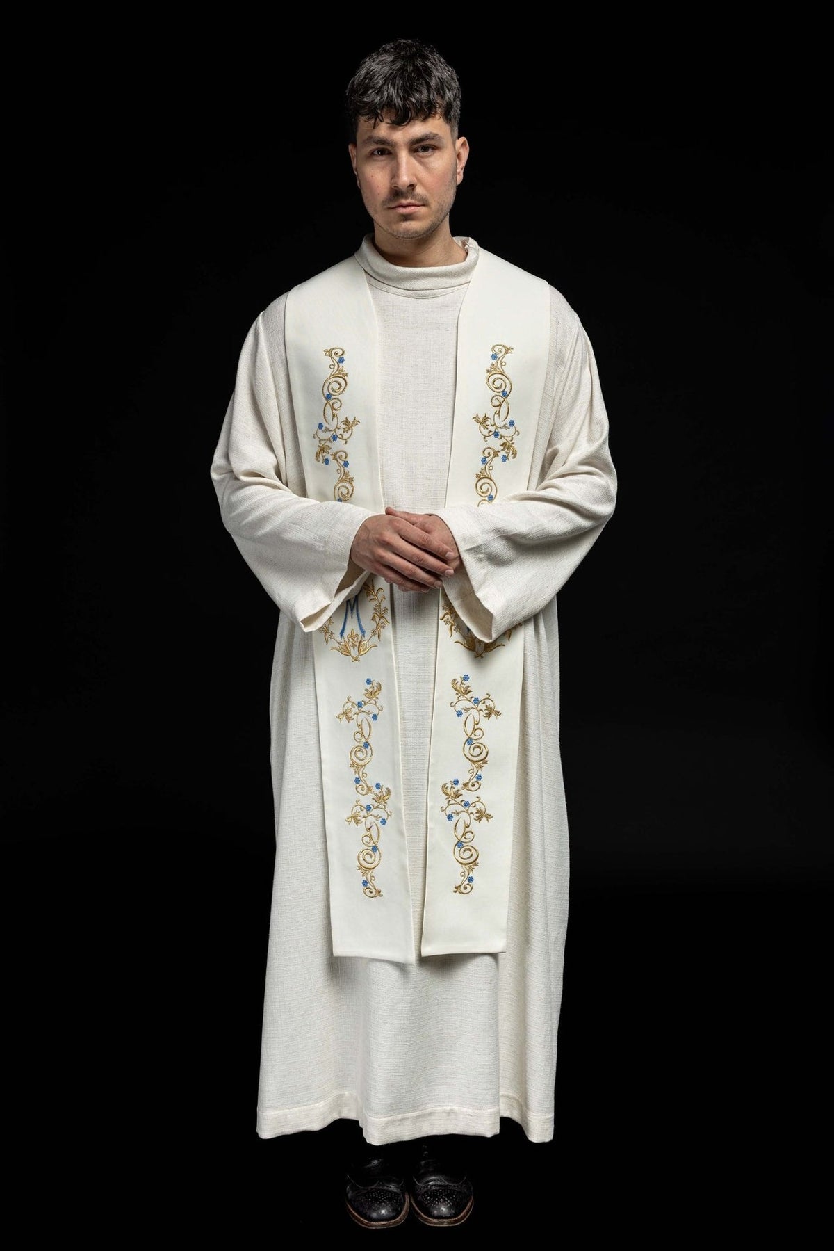 Embroidered Marian stole front view worn, showing symmetrical gold and blue motifs