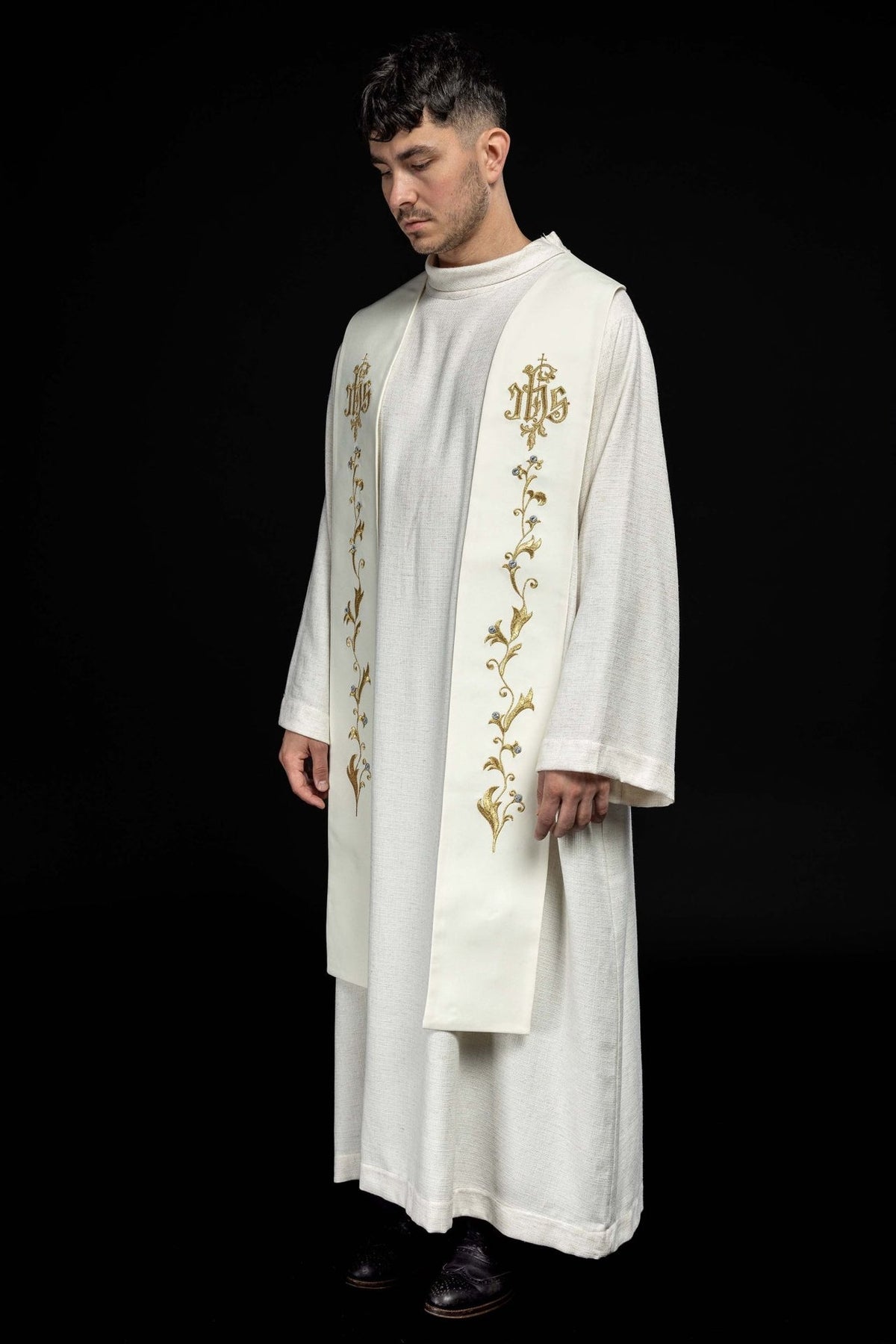 Ecru stole worn from a side angle, showing the full embroidered floral panels
