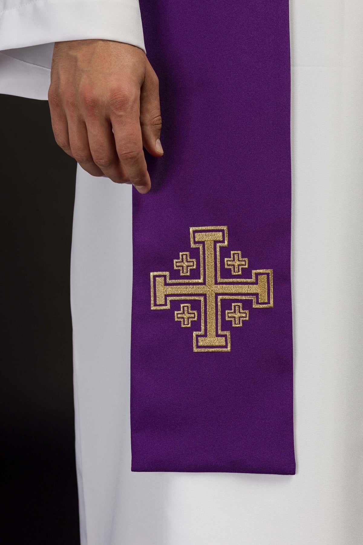 Purple stole close-up showing embroidered gold Jerusalem cross