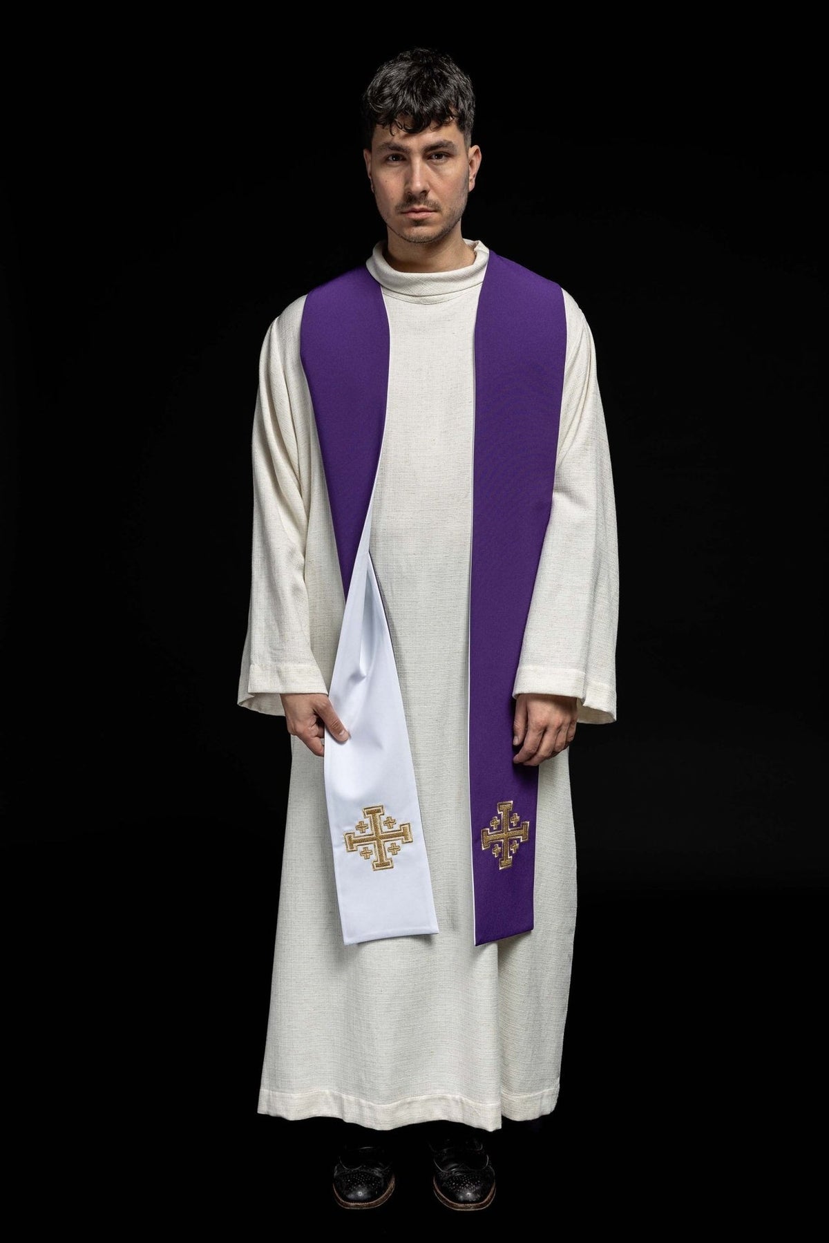 Embroidered stole worn front, showing both purple and white sides with Jerusalem crosses