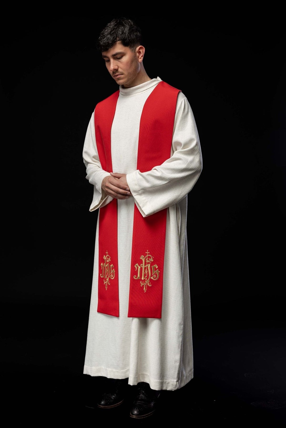Red embroidered stole worn three-quarter front view with matching gold IHS embroidery