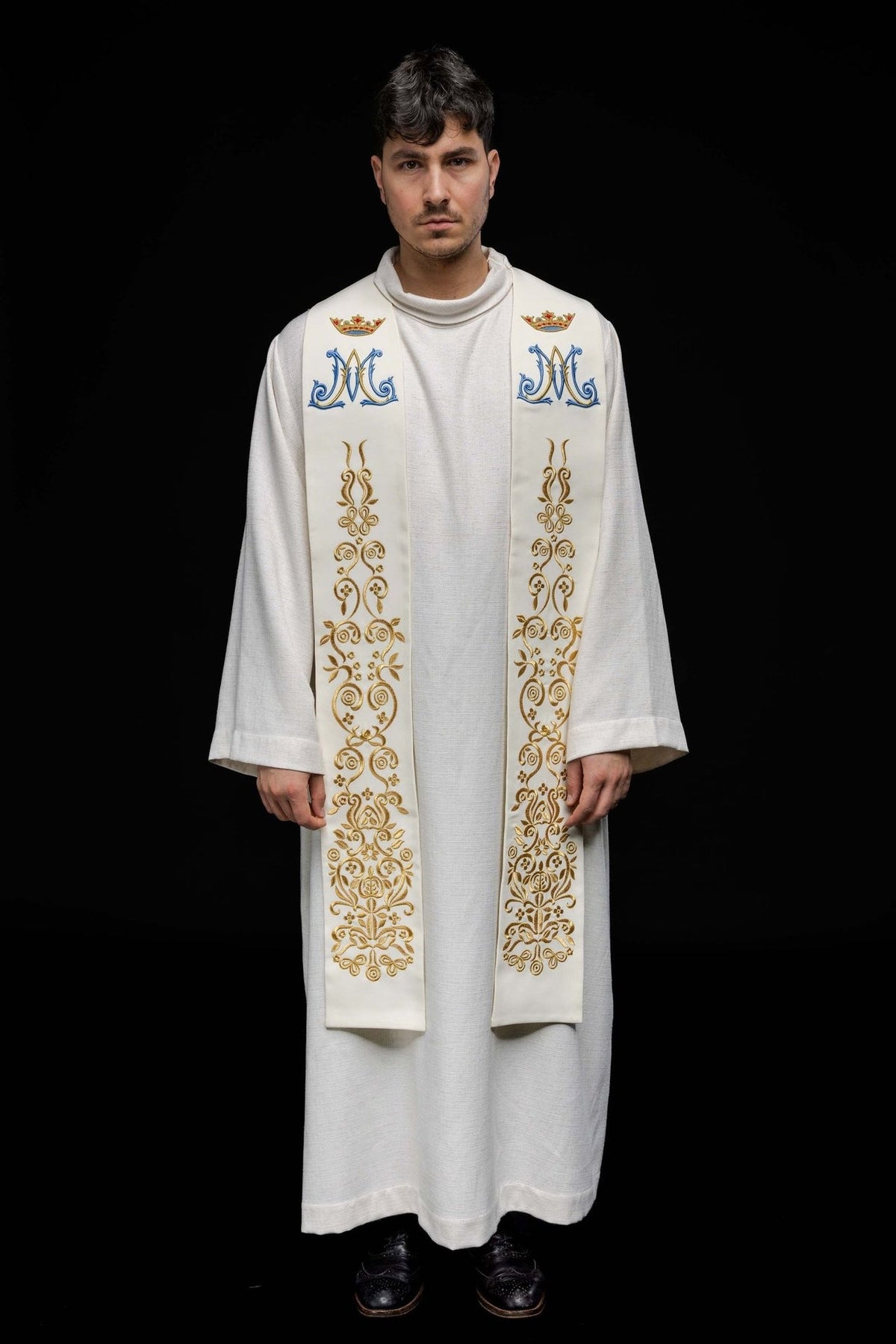Marian ecru stole worn front-facing with full-length blue and gold embroidered motifs