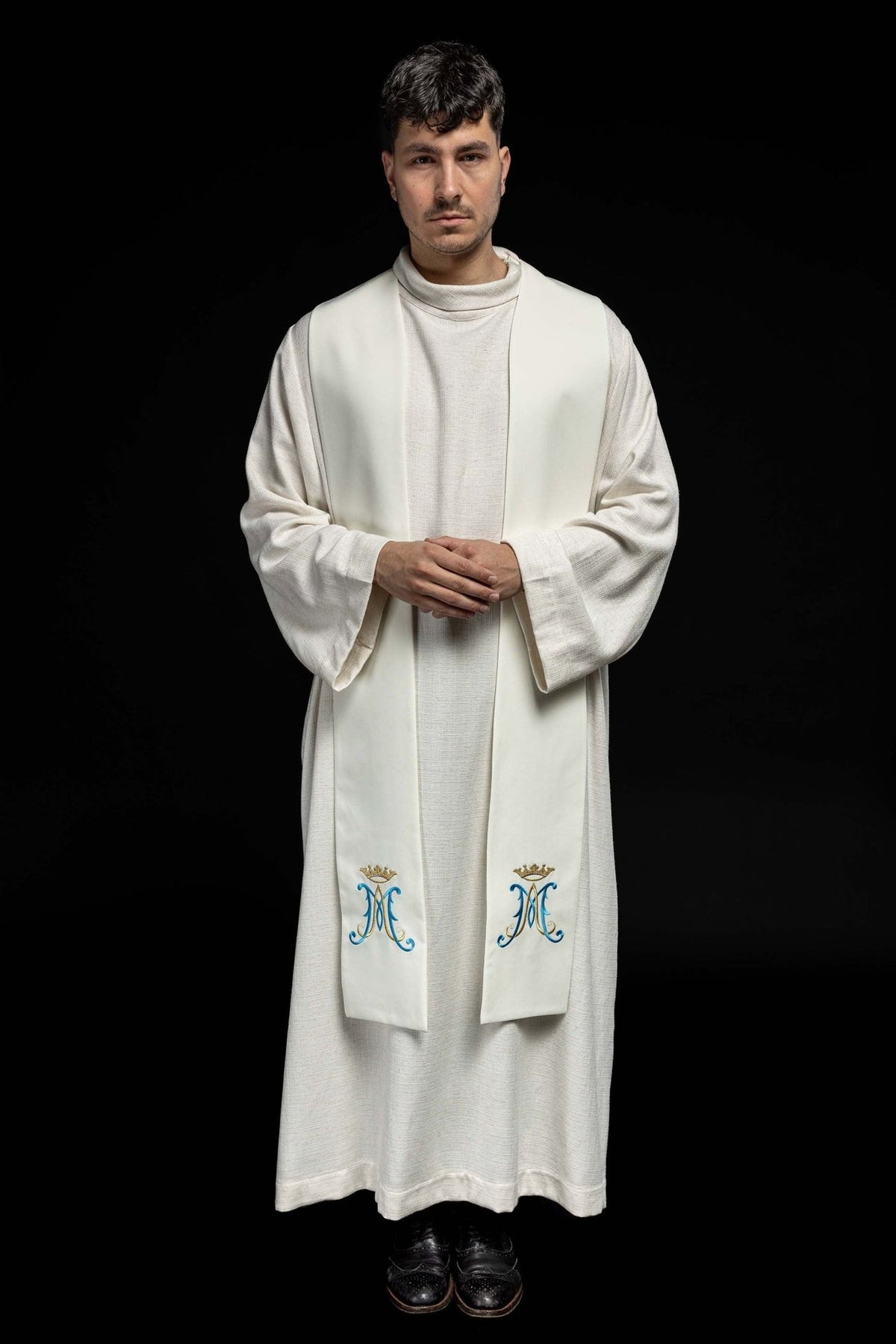 Embroidered Marian stole front view worn, showing matching crowned Marian symbols