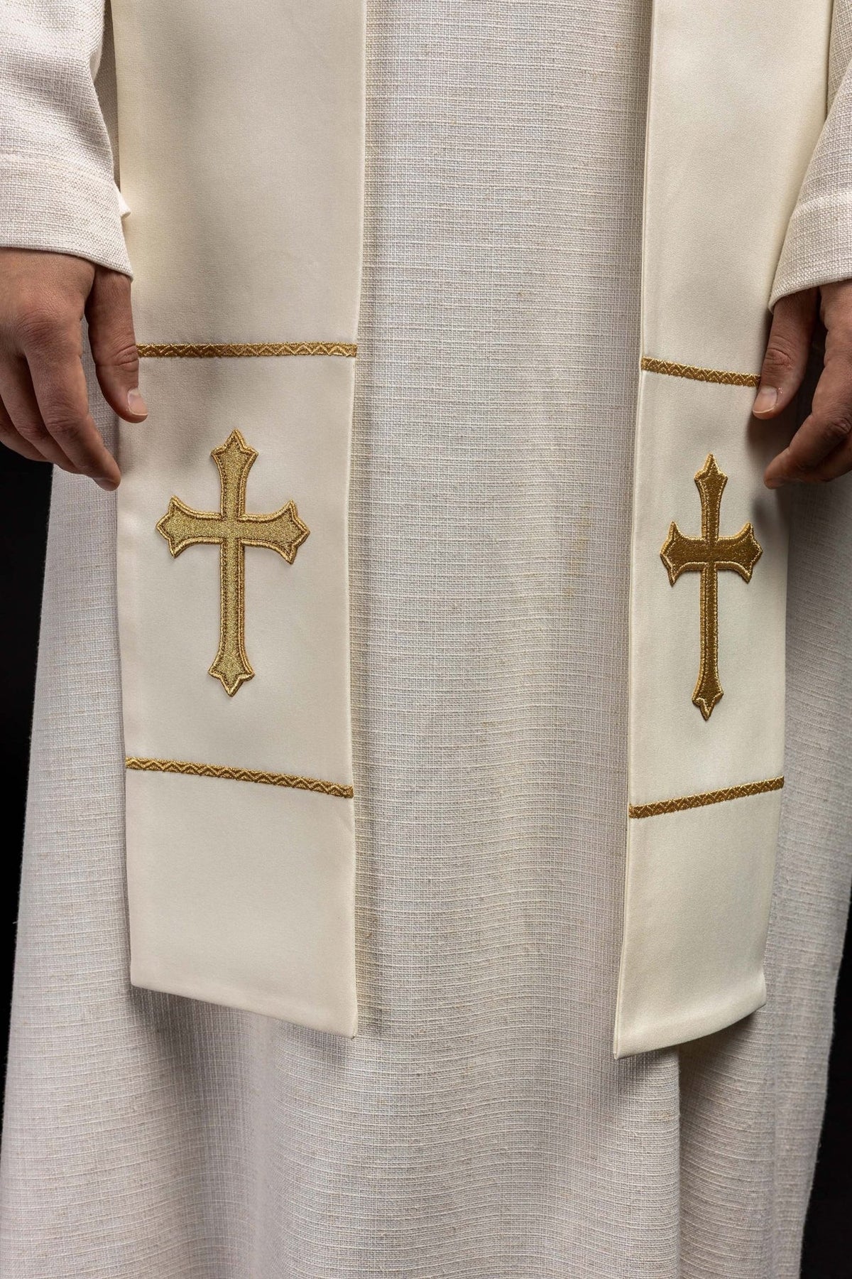 Ecru priest stole close-up with matching gold embroidered crosses and trim