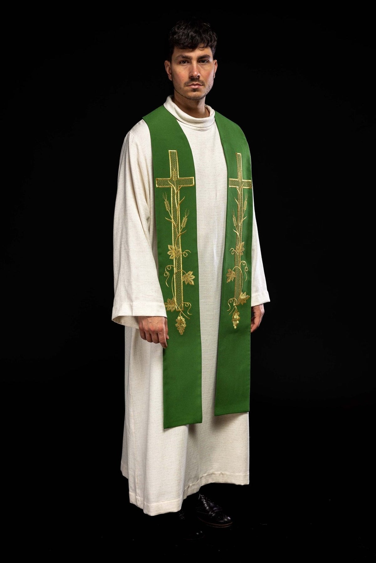 Green embroidered priest stole worn in a three-quarter front view