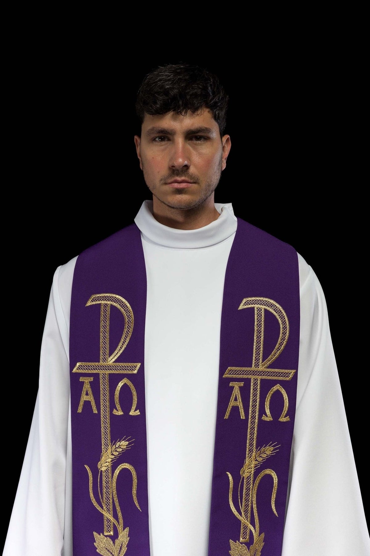 Purple priest stole close-up showing embroidered Alpha Omega symbols