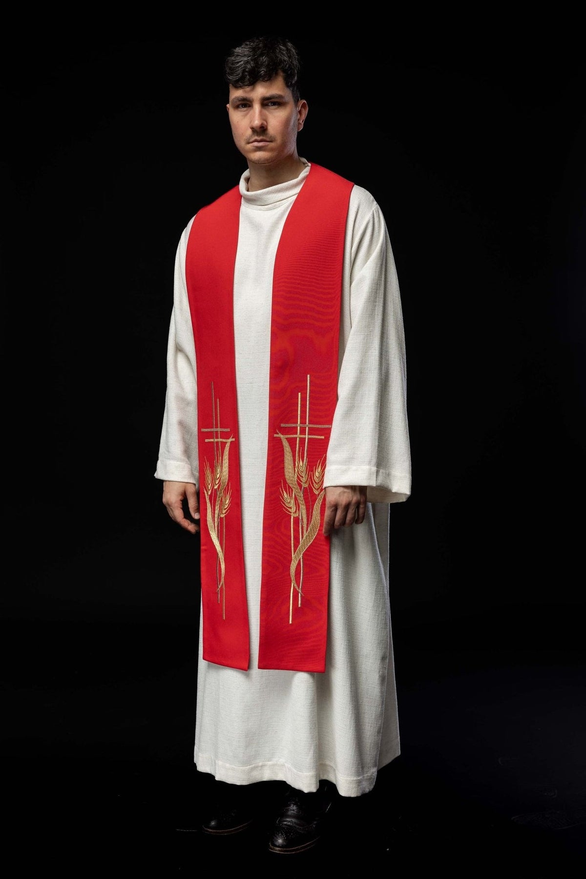 Red priest stole worn front three-quarter view with gold wheat embroidery