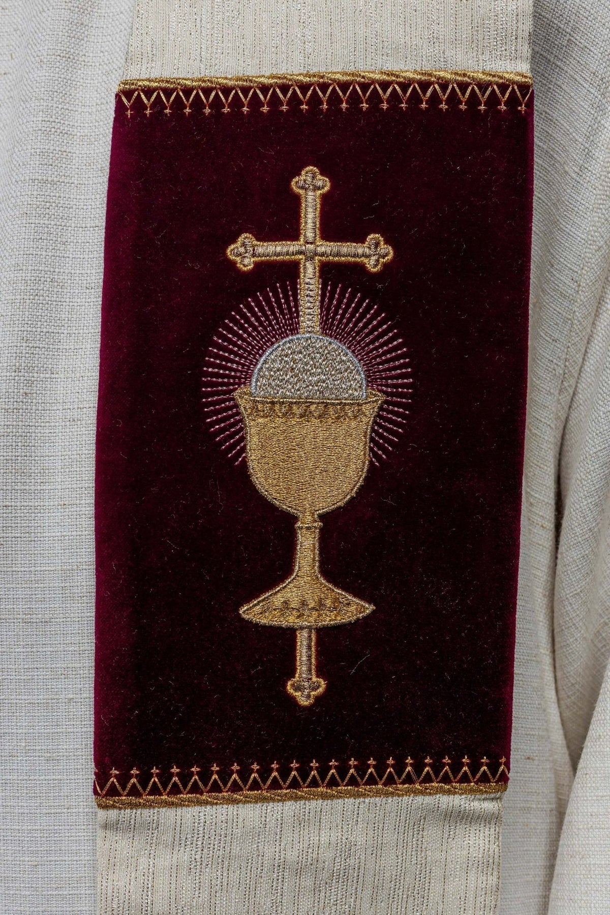 Stole with embroidered communion chalice, cross and rays on a burgundy panel